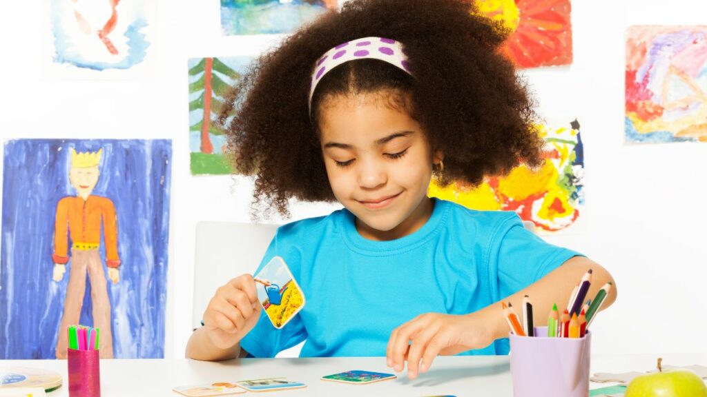 Child focused on coloring a picture_