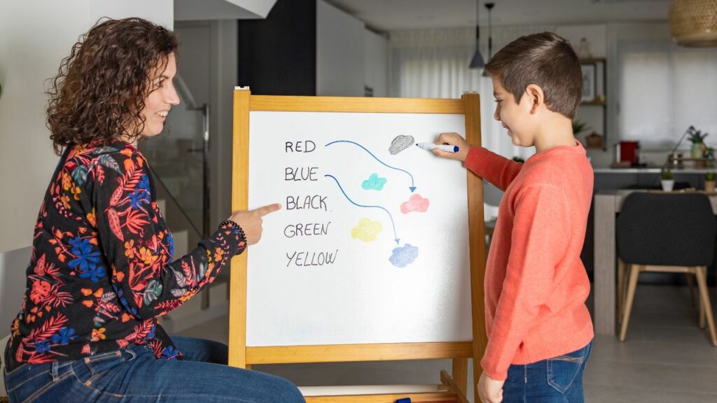 Teacher helping a child connect words_